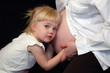 pregnant mother and daughter