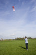 man flying a power kite