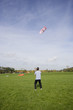 man flying a power kite