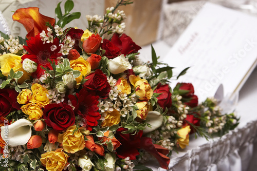 brides bouquet with a guest book in the background brides bouquet with a guest book in the background