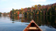 autumn lake reflection with a canoe