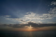 sun behind clouds