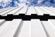 corrugated iron roof against cloudy sky corrugated iron roof against cloudy sky