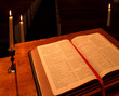 bible on pulpit in candlelight - angled view