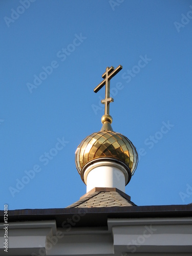 the gilt dome and cross of an orthodox chapel in volgograd