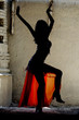 woman dancing belly-dance in oriental costume