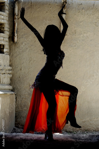 Photo: woman dancing belly-dance in oriental costume woman dancing belly-dance in oriental costume