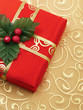 red christmas gift box with gold ribbon