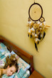girl sleeping with dreamcatcher above