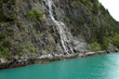 waterfall by a fjord in norway