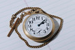 pocket watch on tablet pocket watch on tablet