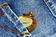gold pocket watch and jean