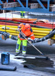 spreading tar on concrete