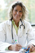 female medical professional writing