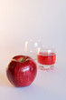 red apple and glasses of juice
