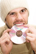 man with hat breaking cd