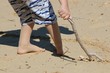 young boy playing on beach young boy playing on beach
