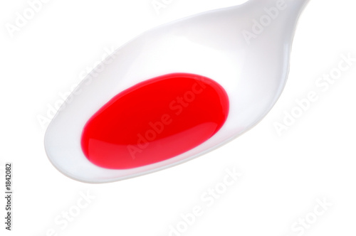 Photo: medicine on white spoon medicine on white spoon