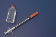 vial of insulin and capped syringe vial of insulin and capped syringe