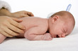 mother touching baby's skin