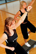 women stepping in a fitness center