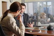business man and woman talking in the office