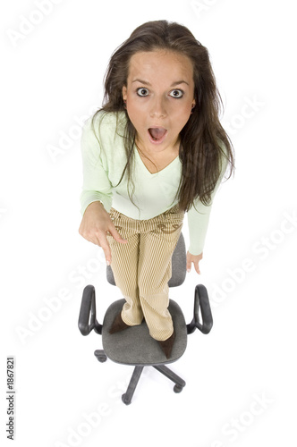 Photo: terrified woman standing on the office chair terrified woman standing on the office chair