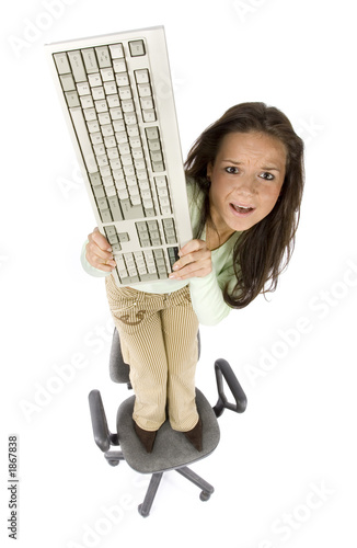 Photo: terrified woman standing on the office chair terrified woman standing on the office chair