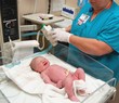 nurse with newborn