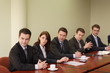 group of 5 business persons sitting at the table group of 5 business persons sitting at the table