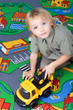 little boy playing with his toy.