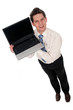 businessman holding laptop, smiling