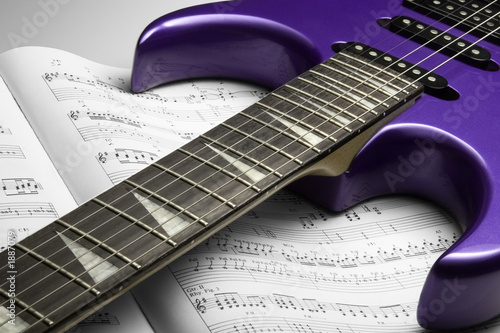 Photo: electric guitar on sheet music electric guitar on sheet music