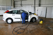 man cleaning a car