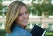 female student holding book