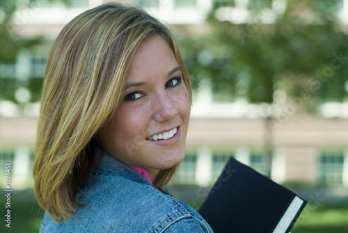 female student holding book