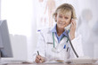 Photo: female doctor on phone female doctor on phone