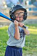 boy batting baseball