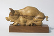 isolated wooden sculpture of pig with clipping path