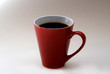 red cup of black coffe