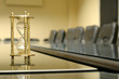 sand clock in the empty board room