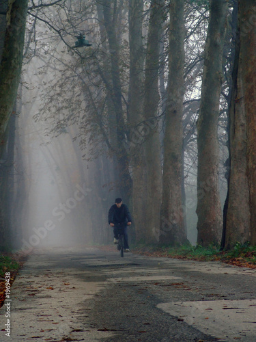 Photo: old man cycling at alley old man cycling at alley