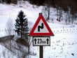 road sign- 23km curves road sign- 23km curves