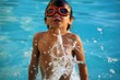 boy playing in a pool