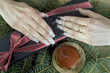 woman's hands over a giftbox woman's hands over a giftbox