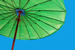 bright green umbrella against a blue sky bright green umbrella against a blue sky