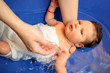 a baby girl in a bathtub