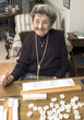 Photo: senior woman at the game table senior woman at the game table