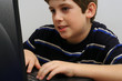 young boy checking email young boy checking email