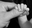 holding daddy's thumb